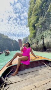 The Trip That Reminded Me Why Women Deserve Luxury: My Journey Through Thailand | Felicia on boat at Phi Phi Island