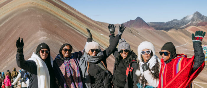 Group of my travel besties in peru at Rainbow Mountain Why Traveling to Peru Was One of the Best Investments I’ve Made in Myself | Group of my travel besties in peru at Rainbow Mountain scaled