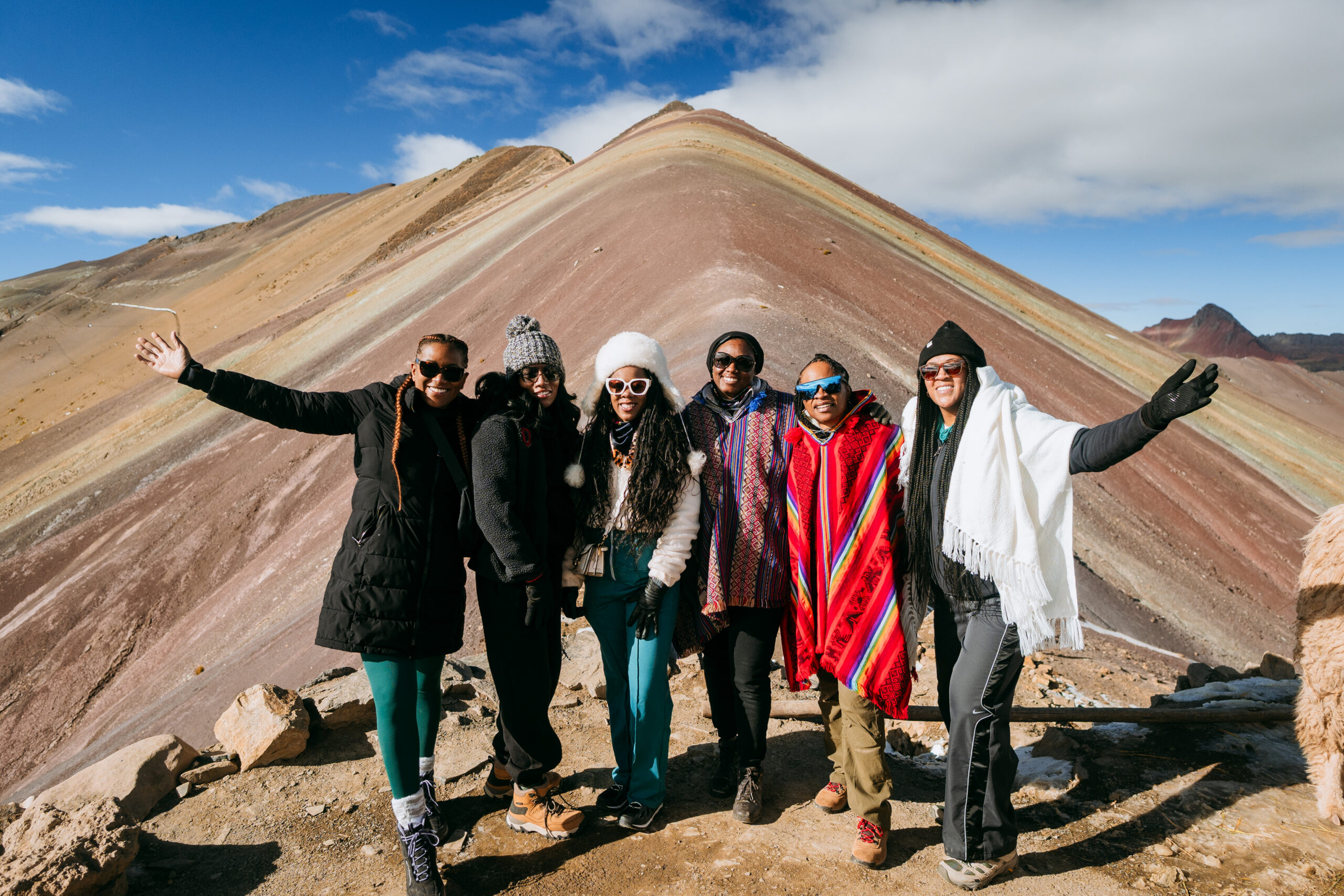 Why Traveling to Peru Was One of the Best Investments I’ve Made in Myself | LLAMAS on top of Rainbow Mountain are so cool scaled